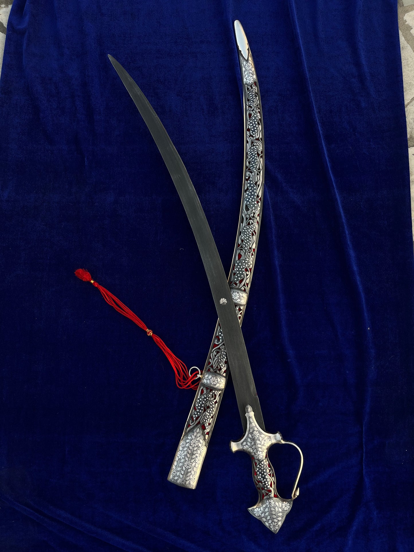 Blue background , with shamsheer sword and sheath displayed all over it