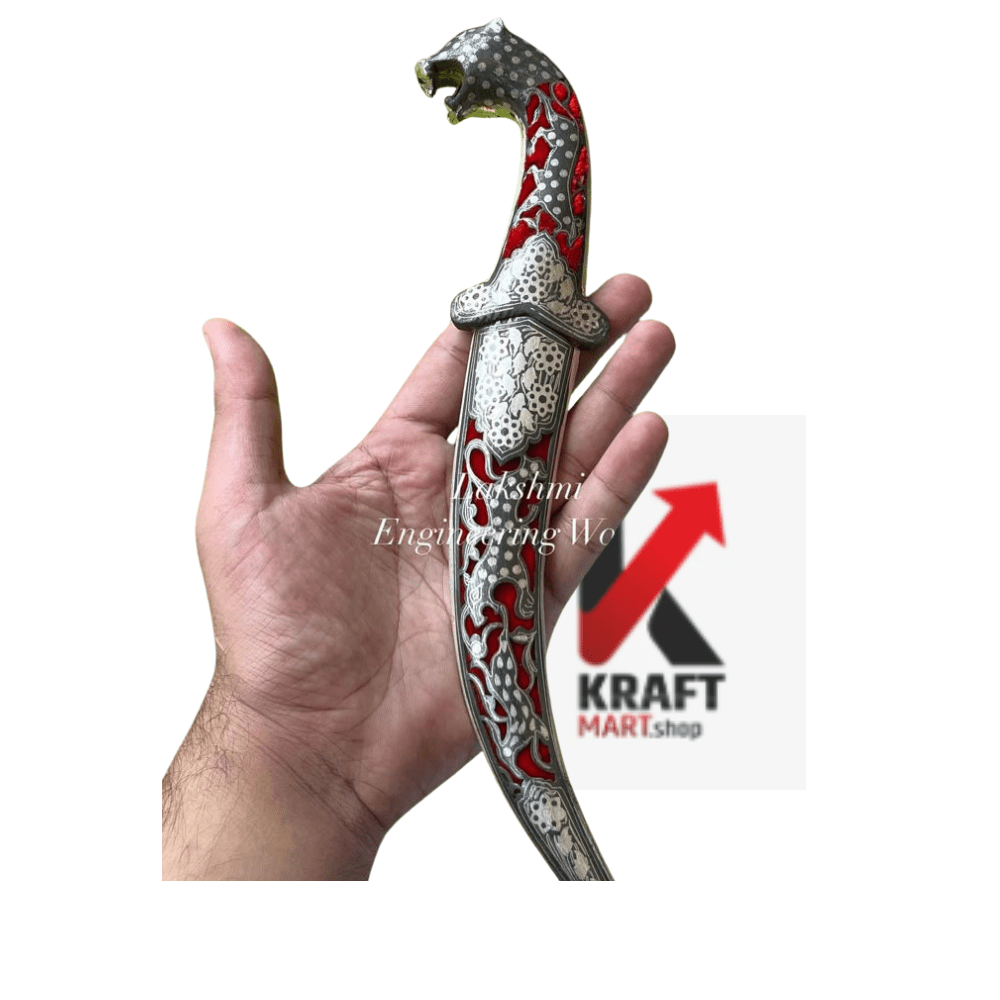 Miniature silver dagger with Damascus steel blade, detailed handle, crafted by KraftMart, displayed on a neutral background.