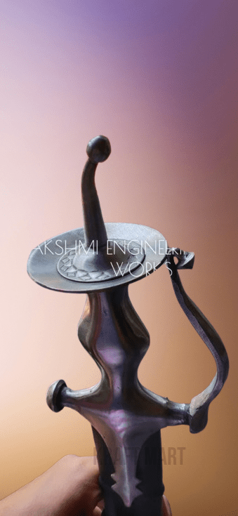 Close-up of engraved Goliya sword blade and hil