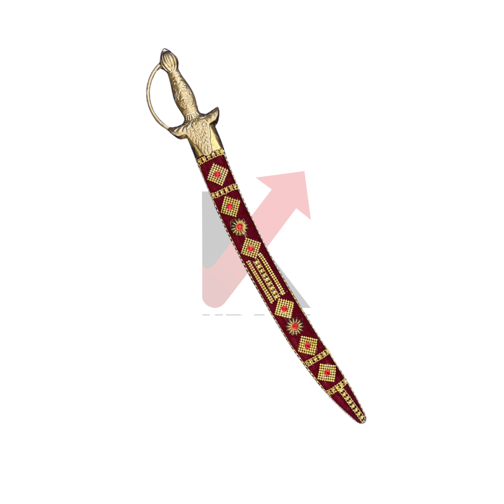 Close view of an Indian brass hilt sword with maroon scabbard, featuring intricate detailing and handcrafted decorative elements.