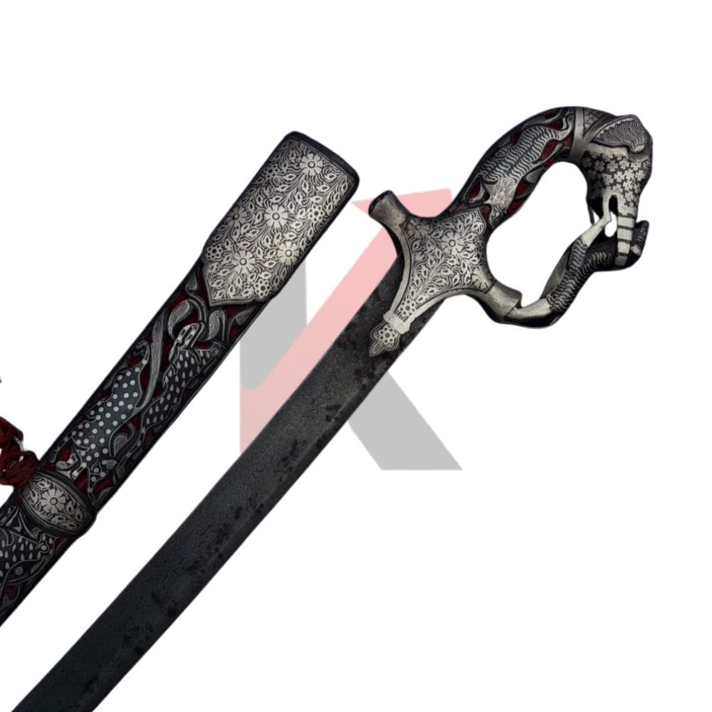 An ornate fantasy sword with a detailed dragon-shaped hilt and matching scabbard, featuring intricate silver filigree engravings and dark red accents, shown against a white background with a kraftmart watermark 