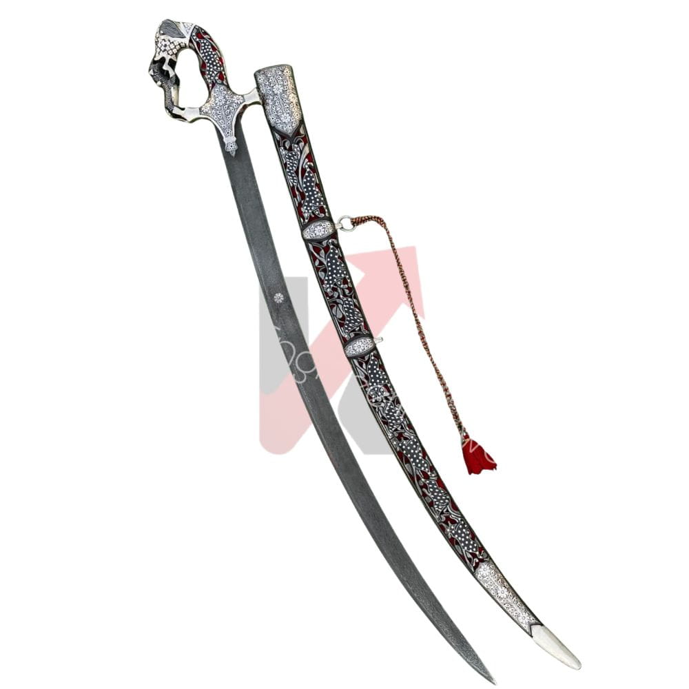 A decorative curved sword with an ornate silver-toned hilt, a dark patterned scabbard, and a red tassel, shown on a plain white background. Imperial mughal shamshir by kraftmart ships to worldwide 