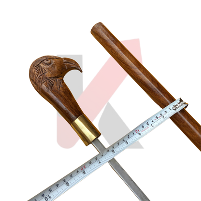 Wooden walking stick with carved eagle head handle and brass detailing