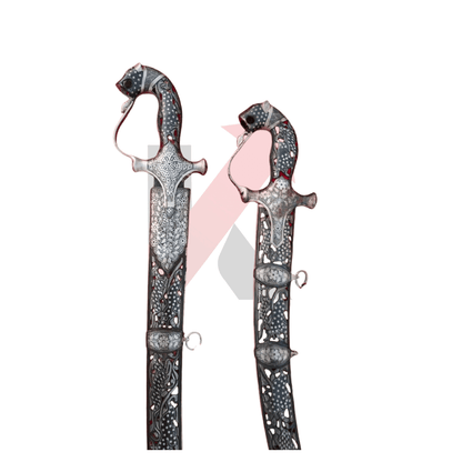 Indian Damascus sword featuring fixed red scabbard inlay and silver details