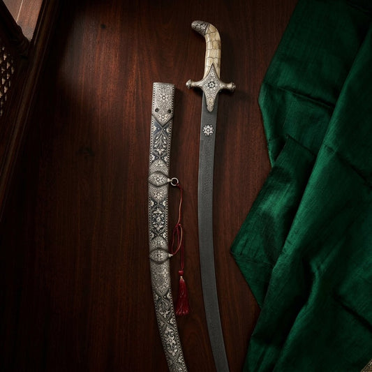 Kilij sword with Damascus steel blade and bone handle featuring silver koftgiri inlay