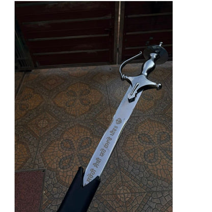 Punjabi Traditional Khanda resting in black leather sheath, hilt visible